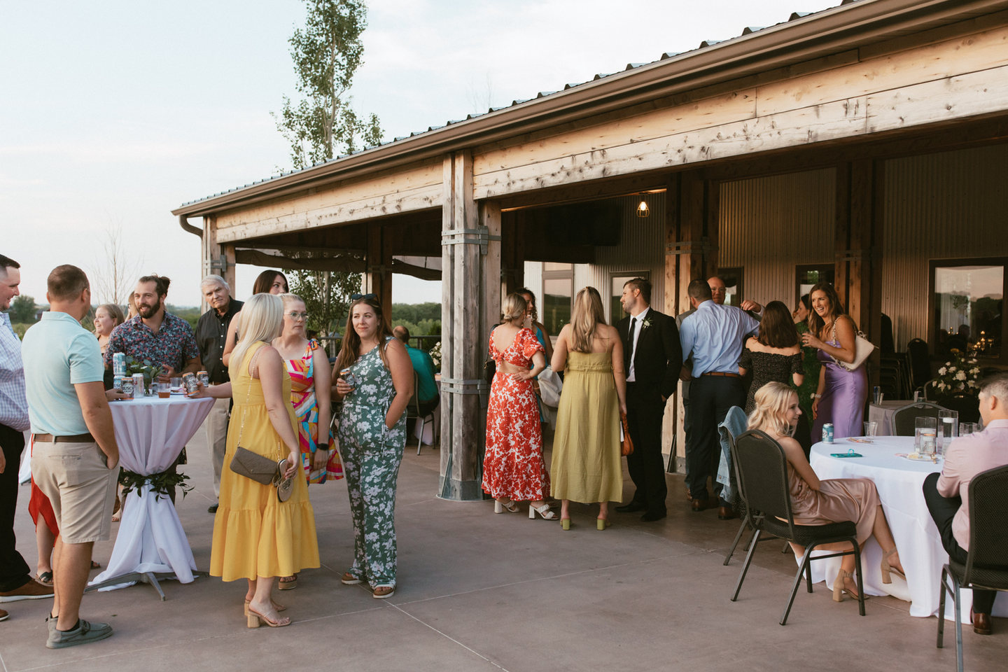 Guests gathering on the covered vineyard patio
