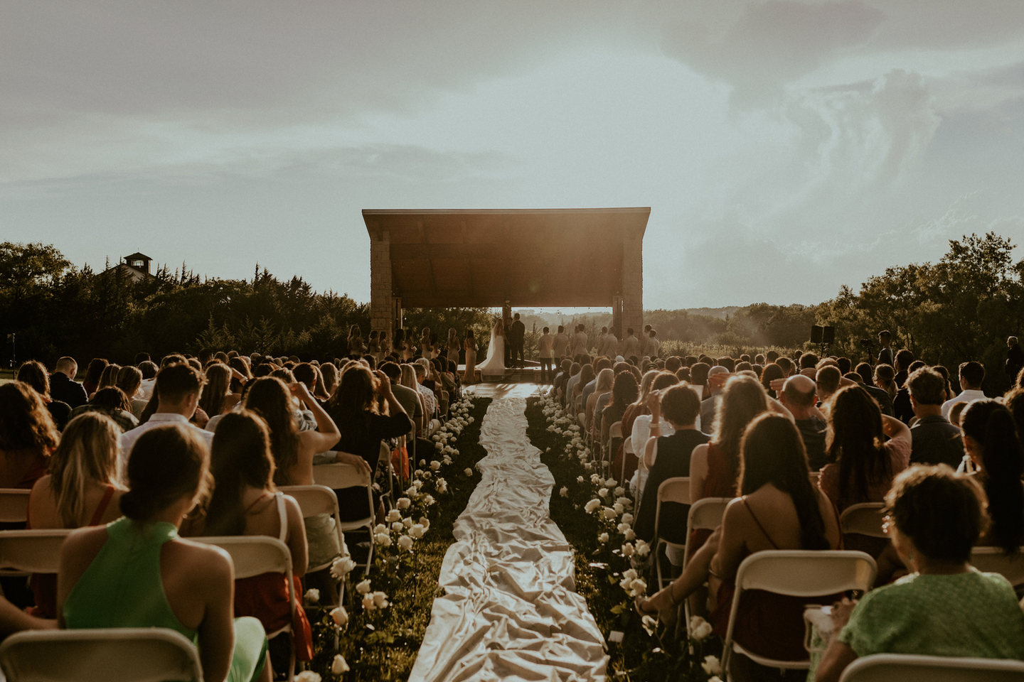 Wedding guests gathered on the ceremony lawn at Glacial Till Vineyard in Palmyra