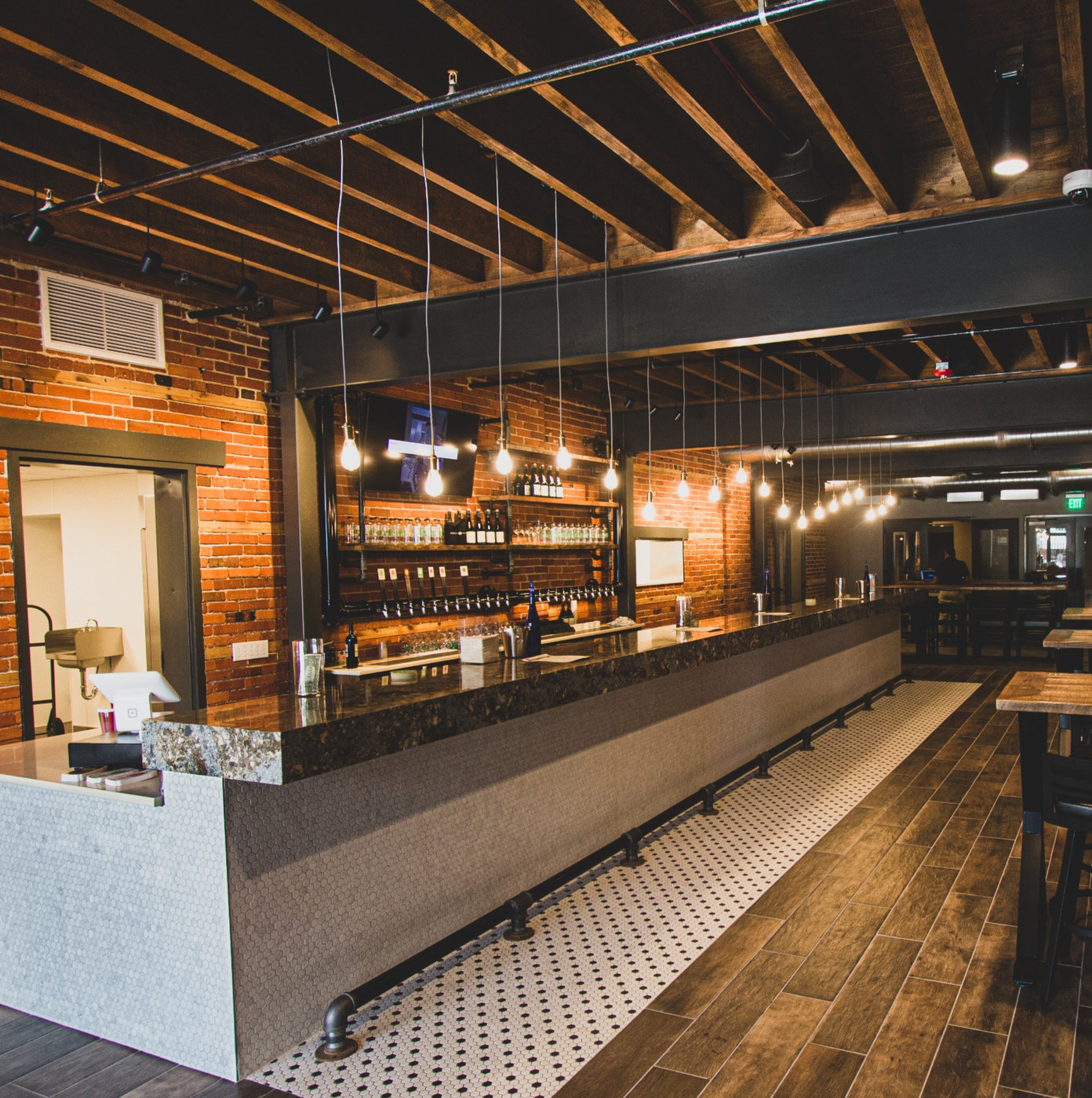 The bar and exposed brick interior at Glacial Till in Ashland